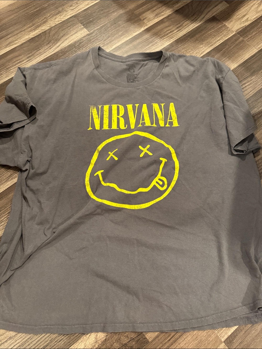 NIRVANA Charcoal Tee with Yellow Smiley Graphic